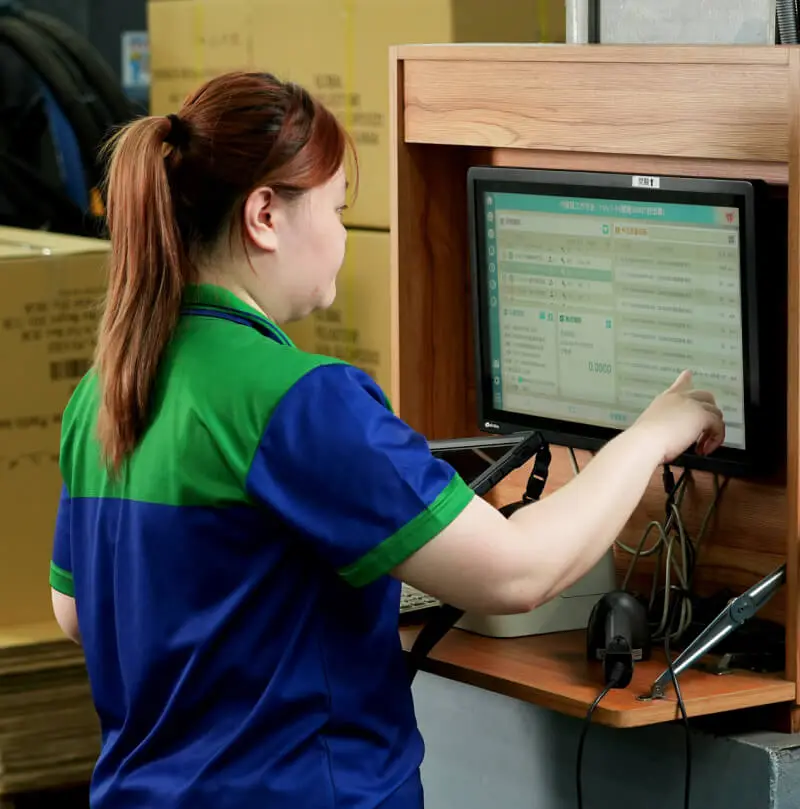 AMP team member operating a production station for assembly and packaging