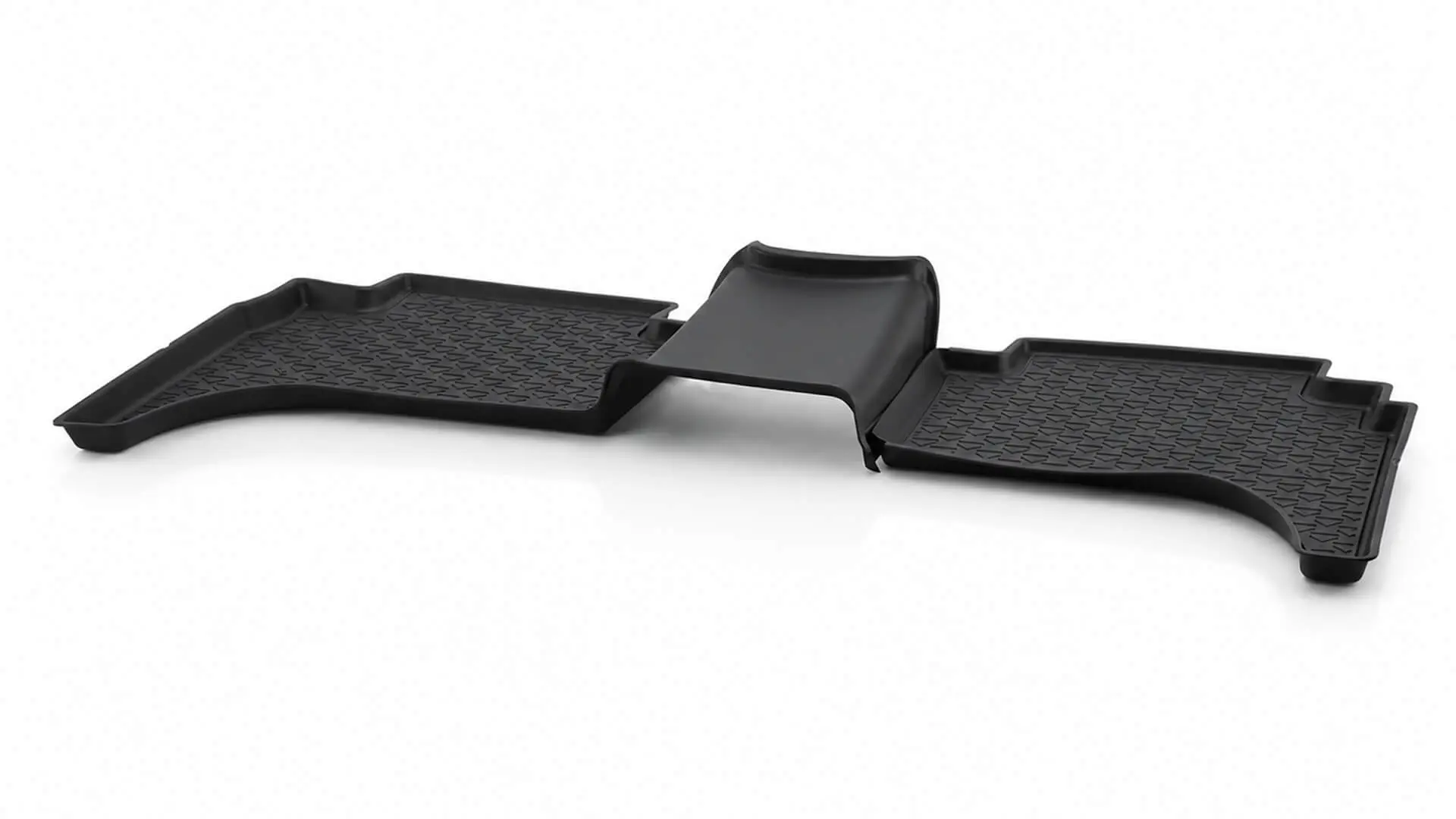 Injection-molded automotive floor mat or cargo tray with textured surface manufactured by AMP