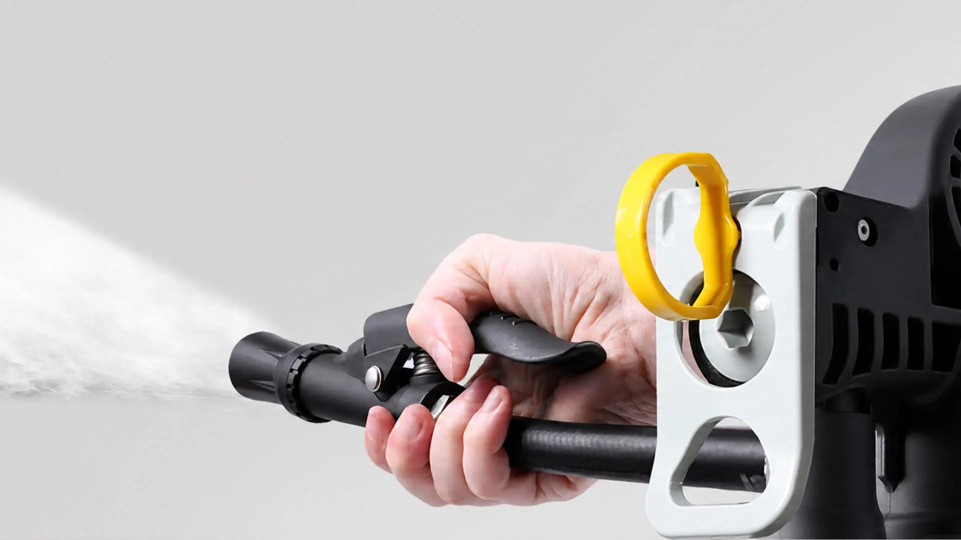 Hands holding an Eco Elephant transparent polycarbonate fire extinguisher with yellow safety pin, produced by AMP in Taiwan