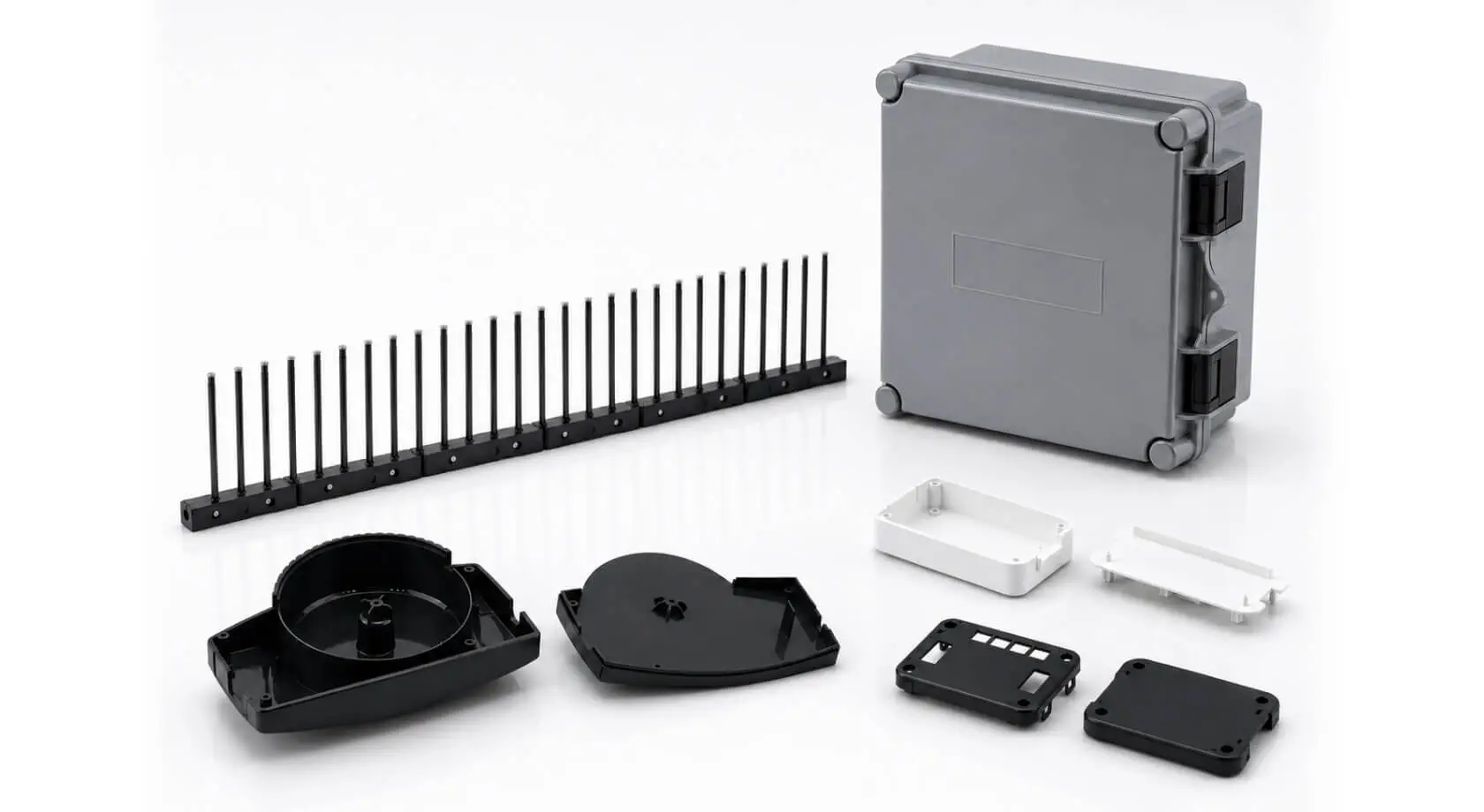 Precision-molded plastic electronics components including an enclosure, housings, and connector parts manufactured by AMP