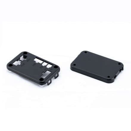 AMP injection-molded electronics housing with matching cover plate, featuring screw bosses and connector openings for PCB integration