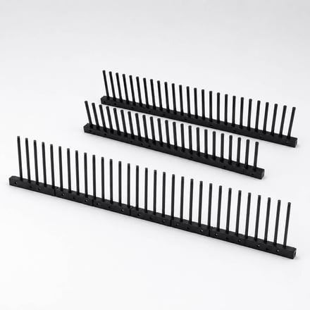 AMP injection-molded carrier for holding LCD television panels, with parts standing on each side and one panel inserted per tier