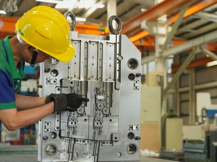 AMP toolmaker inspecting and fitting slide mechanisms and cavity detail on your export mold, with all assembly work completed in-house before trial