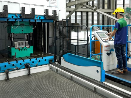 AMP fitting and proving your export mold on our die spotting press, verifying mold-half alignment and parting-line fit before trial and shipment