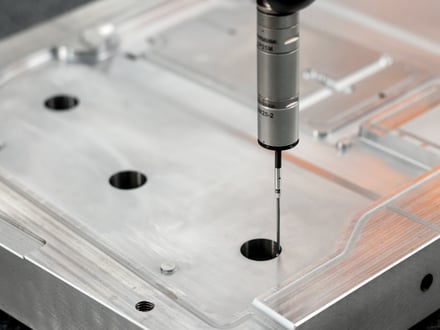 AMP checking critical mold component dimensions with Renishaw CMM probing before assembly, ensuring your export mold meets specification before it leaves our facility