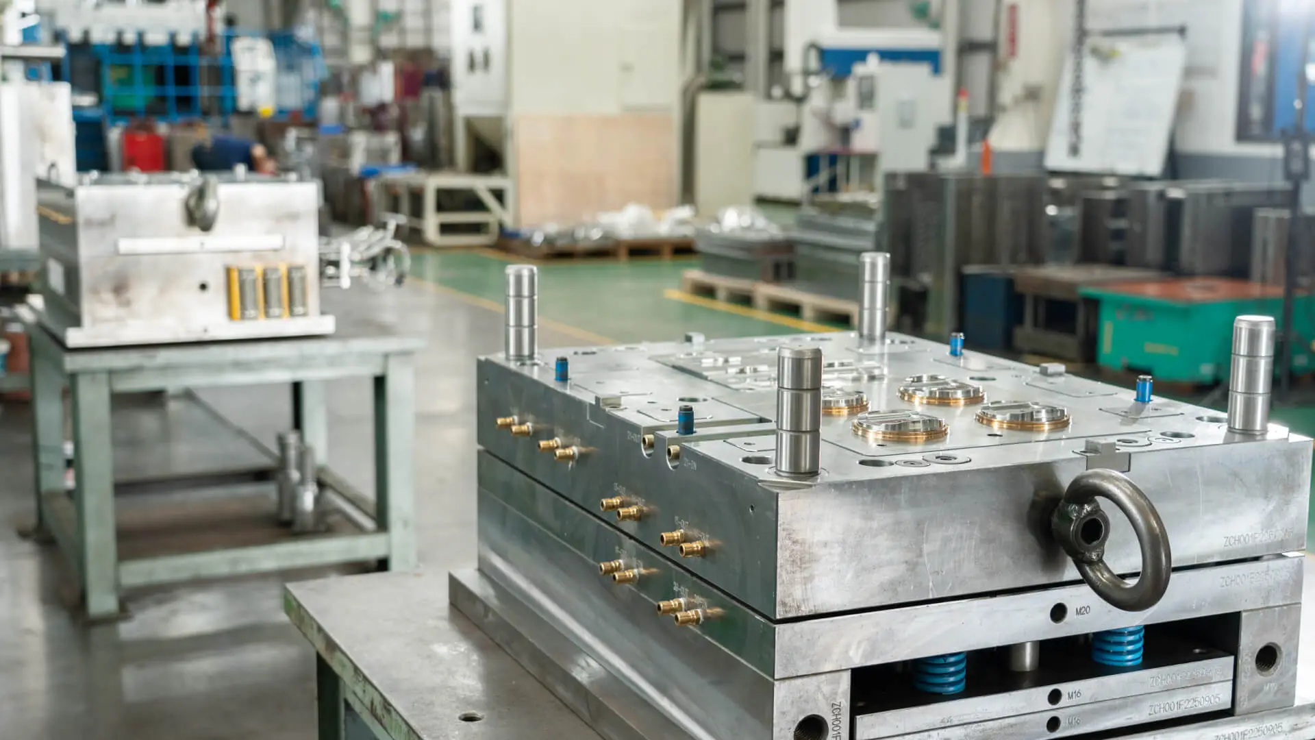 AMP-assembled export mold with guide pins, cooling fittings, and lifting hardware on the shop floor at our Taiwan facility, ready for trial before shipment