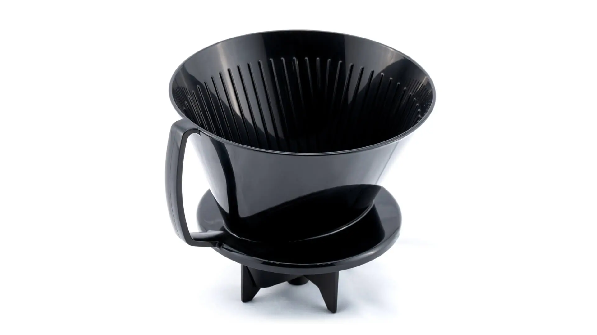 Black injection-molded plastic pour-over coffee dripper with ribbed interior and handle, manufactured by AMP