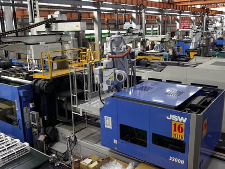AMP's production floor with JSW electric injection molding machines including J650AD and J450ADS models, delivering tighter shot-to-shot repeatability for OEM programs