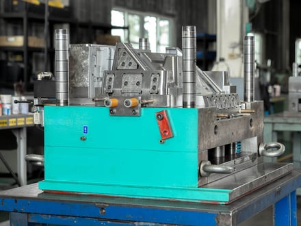 AMP-built injection mold fully assembled with guide pins, slide actions, and return springs, serialized and ready for trial on our production machines