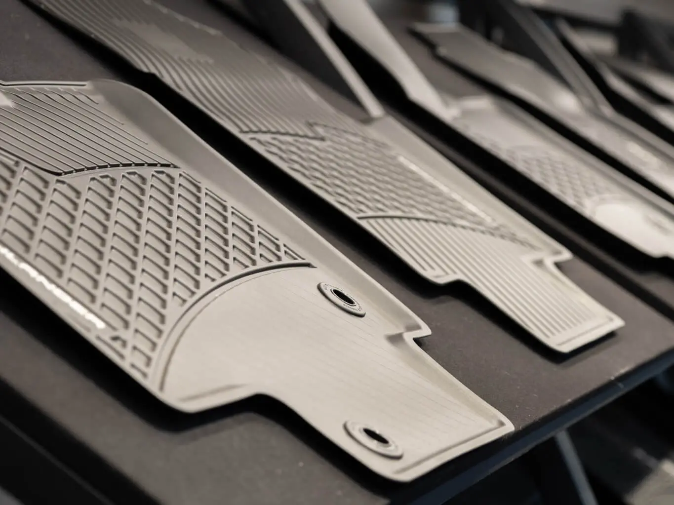 AMP injection-molded components staged after production, showing consistent surface finish from our in-house one-stop molding program