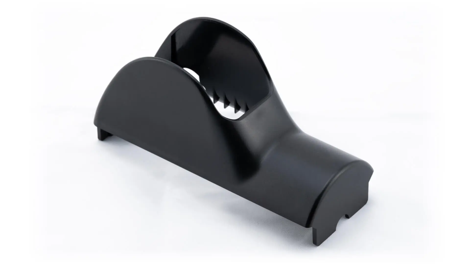 Black injection-molded equipment housing cover with arched profile and internal ribbing for industrial OEM applications, manufactured by AMP