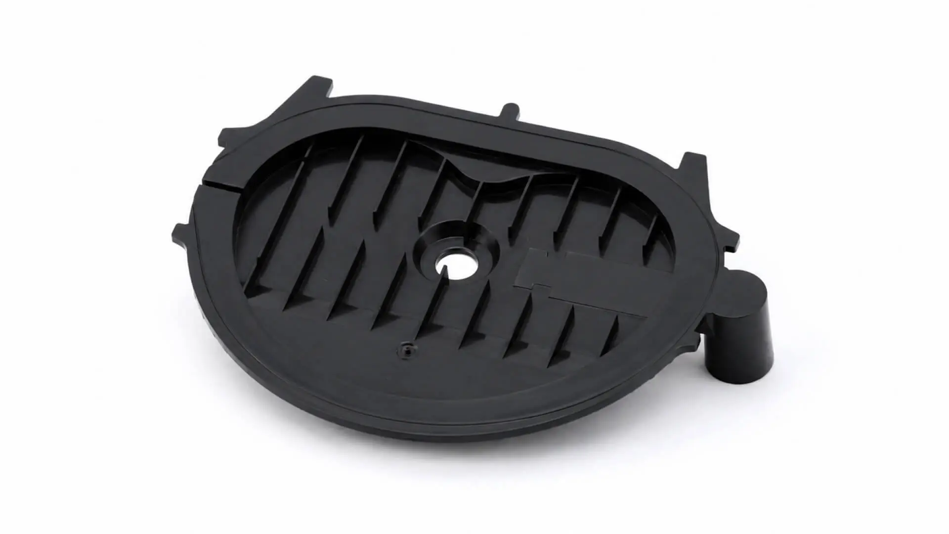Black injection-molded motor housing cover with internal ribbing and central mounting hole for industrial equipment, manufactured by AMP