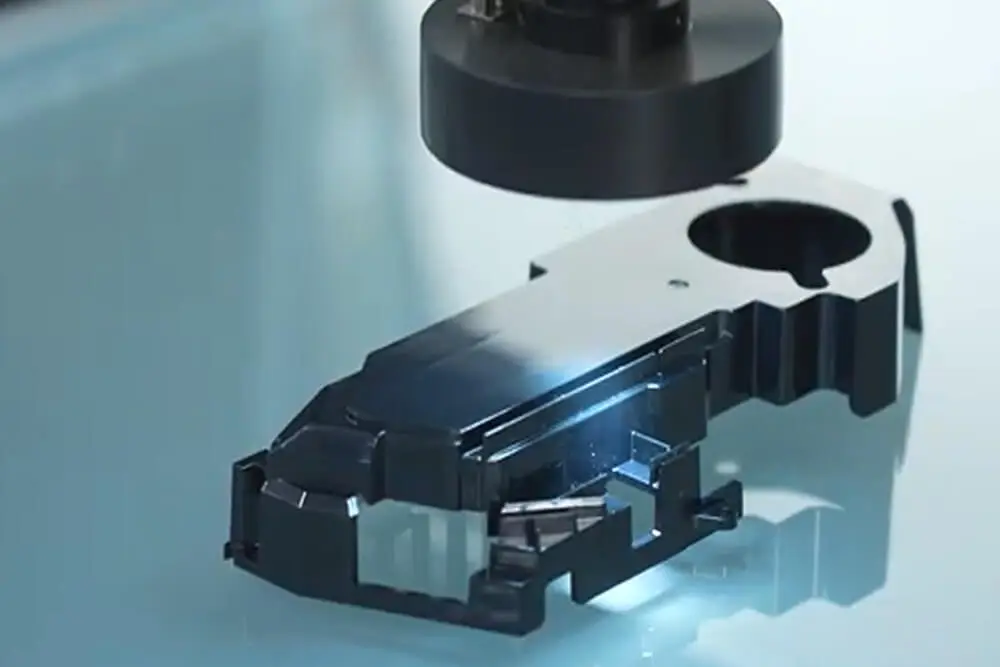 AMP performs optical appearance inspection on finished injection-molded components, checking surface quality and decoration before parts are approved for shipment