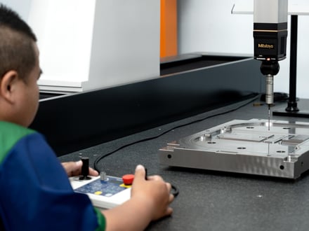 AMP verifying first-article dimensions on our Mitutoyo CMM with Renishaw probe against your CAD data, so your export mold ships with a complete dimensional record