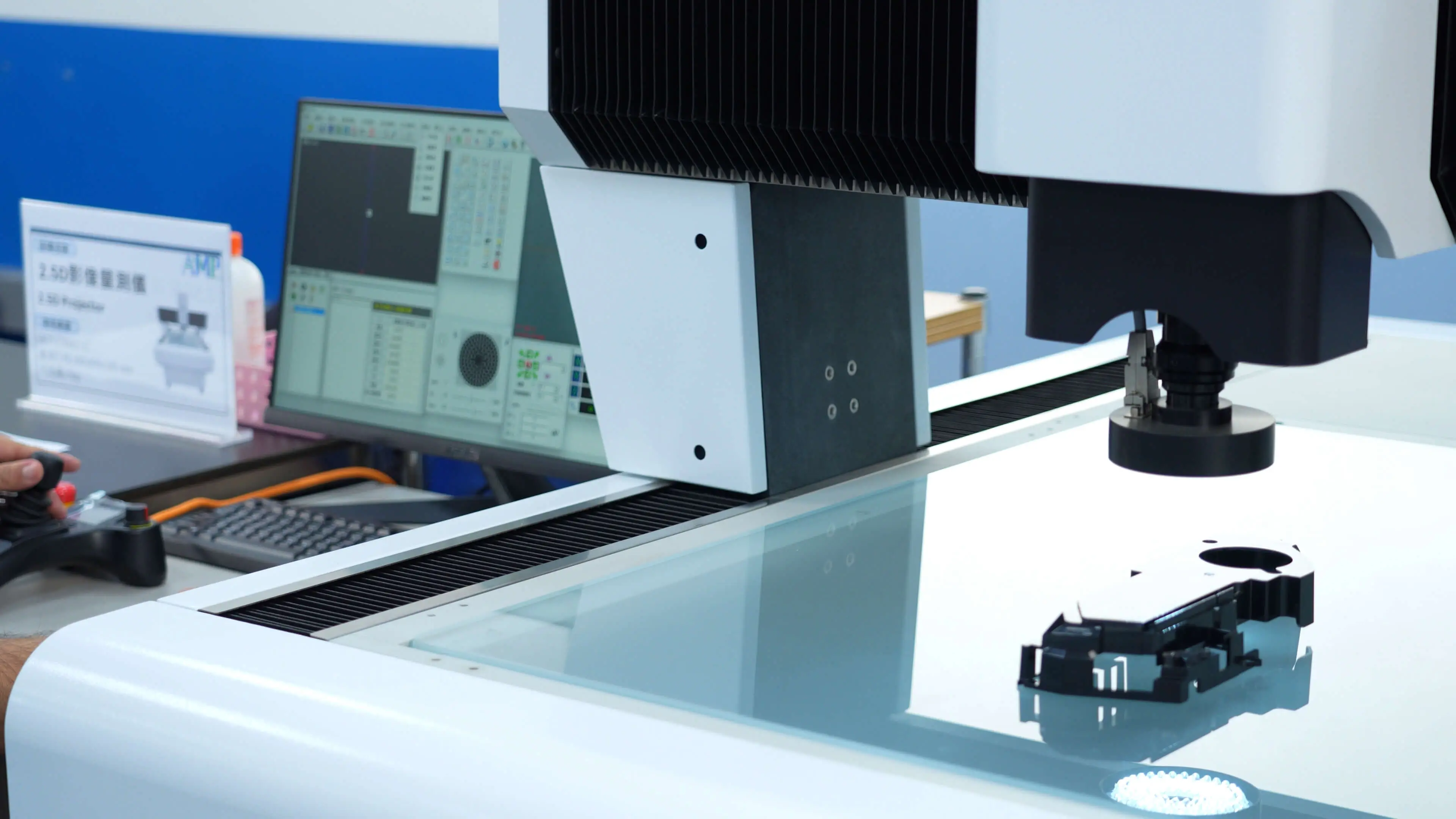 AMP quality technicians operating CMM and measurement equipment in our in-house inspection lab