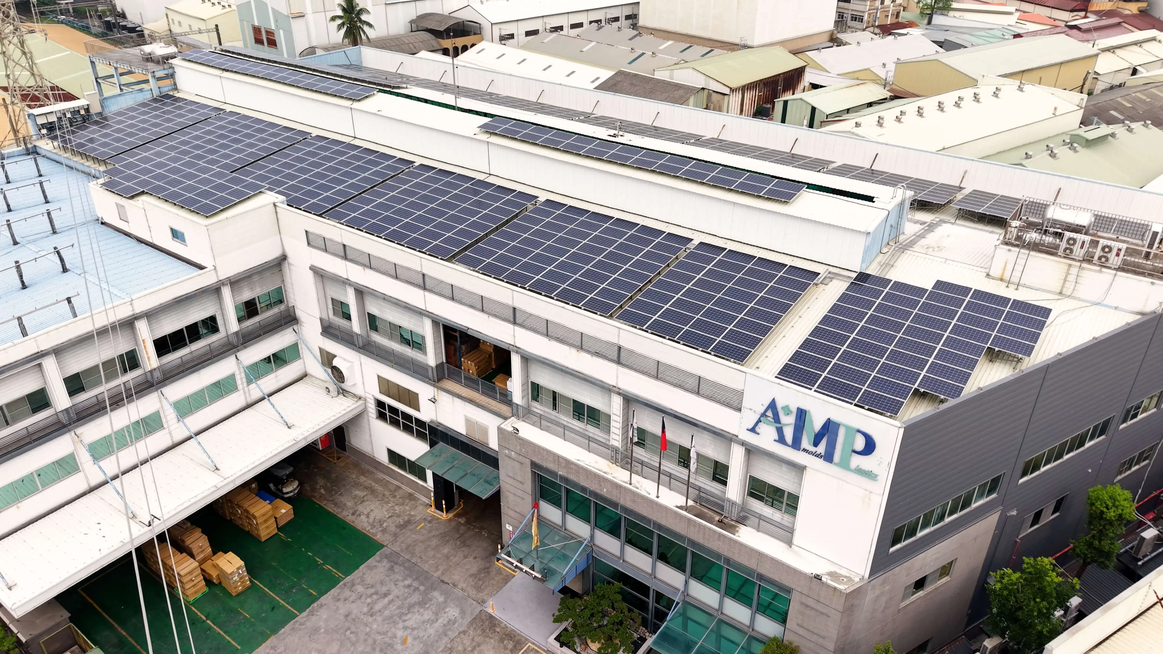 AMP molds factory building with solar panels covering the roof at our Taiwan manufacturing facility