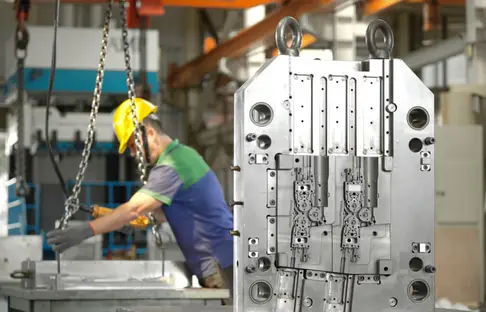 Injection mold base with cavities and guide pins machined at AMP's Taiwan tooling facility