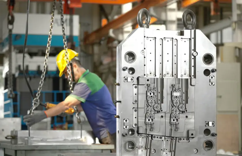 Injection mold base with cavities and guide pins machined at AMP's Taiwan tooling facility