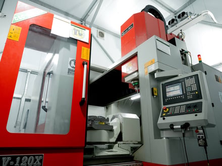 AMP's Quaser V-120X high-speed vertical machining center housed in a climate-controlled room for precision mold component work