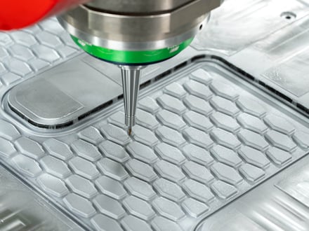 AMP high-speed CNC machining precise pockets and profiles into a steel mold component at our in-house tooling facility