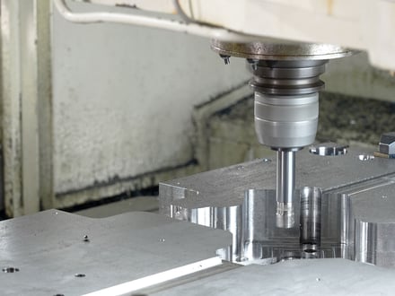 AMP high-speed CNC machining detailed cavity features into a steel mold component at our in-house tooling facility